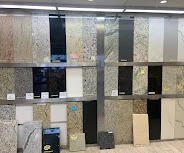 Wall of countertop and tile material samples at the PA Home Supply showroom